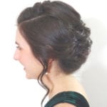 Profile of a woman with an elegant updo hairstyle.