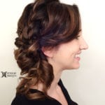 Profile of a woman with a braided hairstyle.