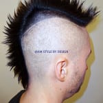 Side profile of a person with a spiked mohawk hairstyle.