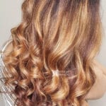 Close-up of brown and blonde curly hair.