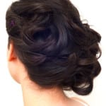Elegant updo hairstyle with soft curls.