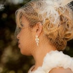 Profile of a bride with elegant hairstyle and veil.