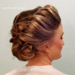 Elegant updo hairstyle with soft curls and volume.