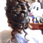 Intricate braided updo hairstyle on a person.