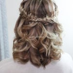 Back view of blonde hair styled with braids and curls.