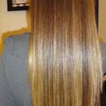 Straight, shiny brown hair seen from the back.