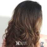 Long wavy brown hair cascading down the back.