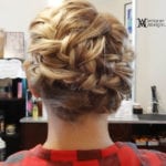 Intricately braided updo hairstyle from the back.