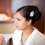 Profile of a woman with a hairpin in an elegant bun hairstyle.