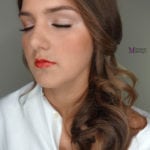 A woman with closed eyes and red lipstick.
