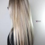 Long straight blonde hair with subtle highlights.
