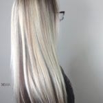 Back view of long, straight platinum blonde hair.