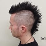A man with a black spiked mohawk hairstyle.