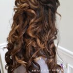 Long curly brown hair styled elegantly.