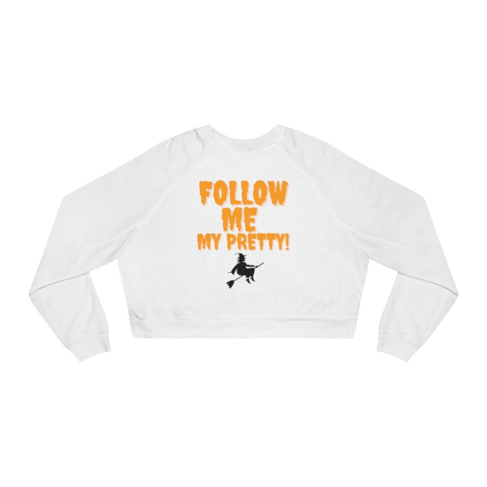 White cropped sweatshirt with orange text and a small graphic.