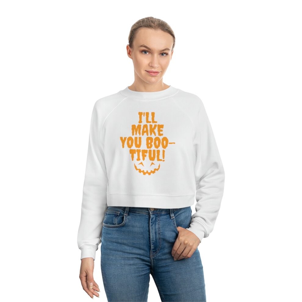 Woman wearing white sweatshirt with orange text.