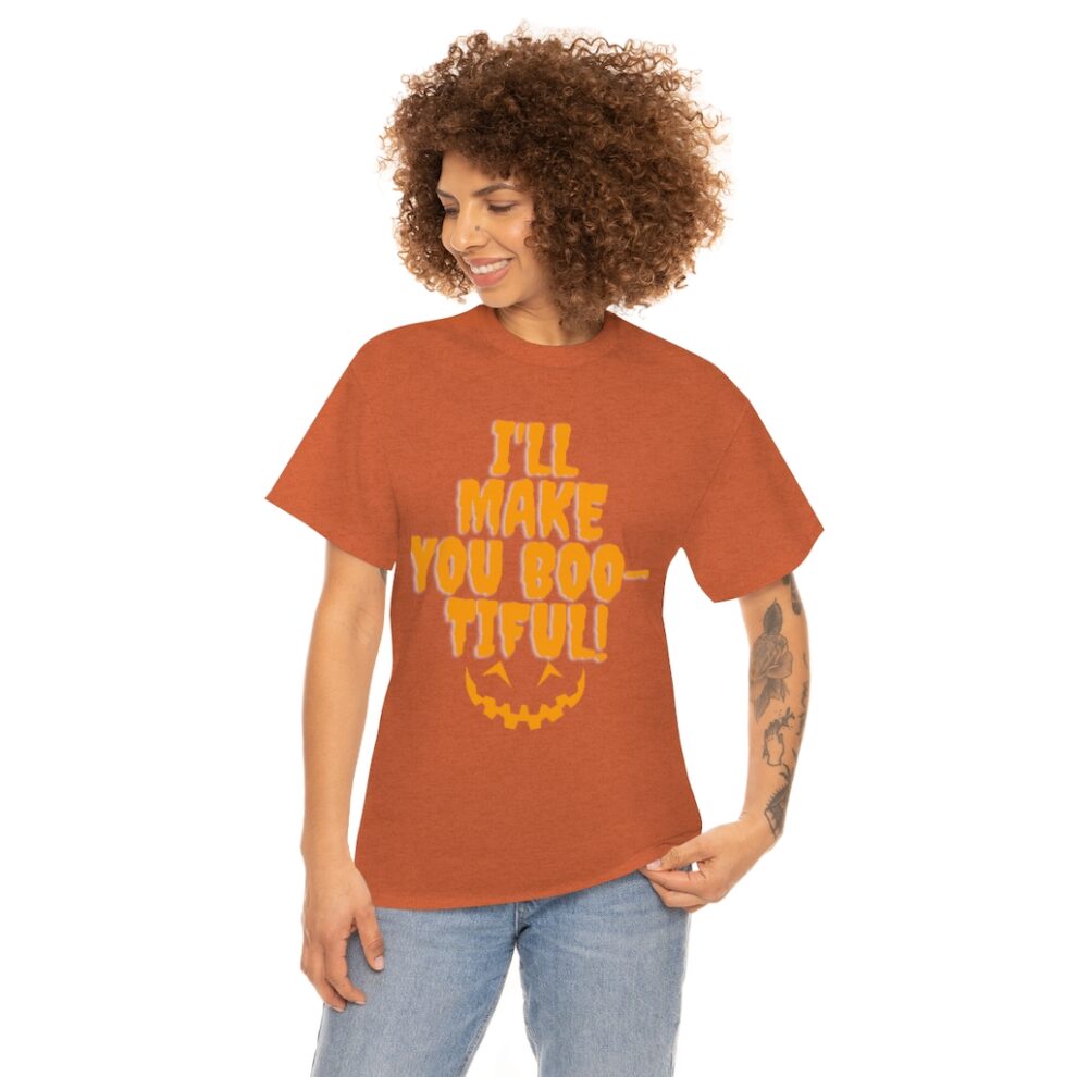 A woman wearing an orange t-shirt with the words " i 'll make you boo tiful ".