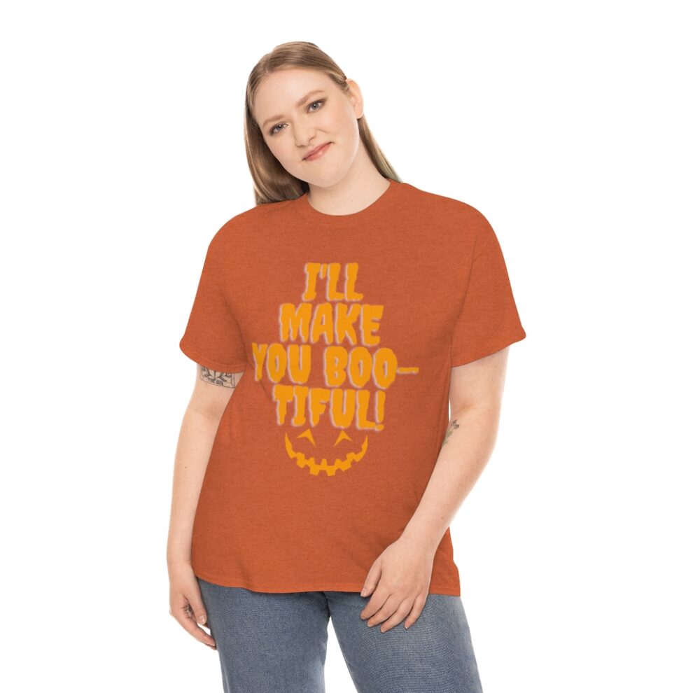 A woman wearing an orange t-shirt with the words " i 'll make you boo tiful ".