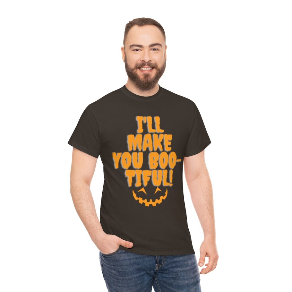 A man wearing a black t-shirt with an orange and yellow design.
