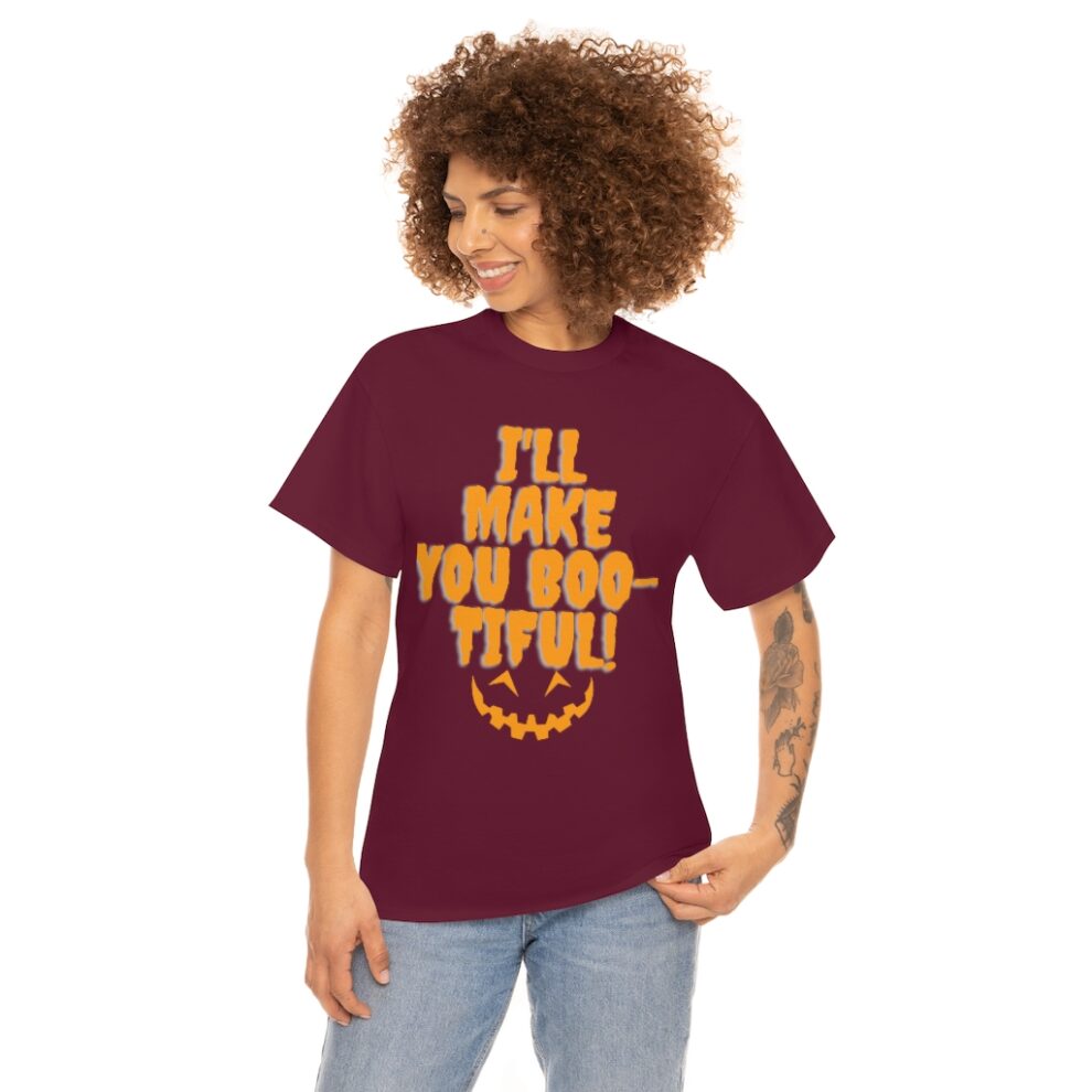 A woman wearing a maroon t-shirt with the words " i 'll make you boo-tiful ".