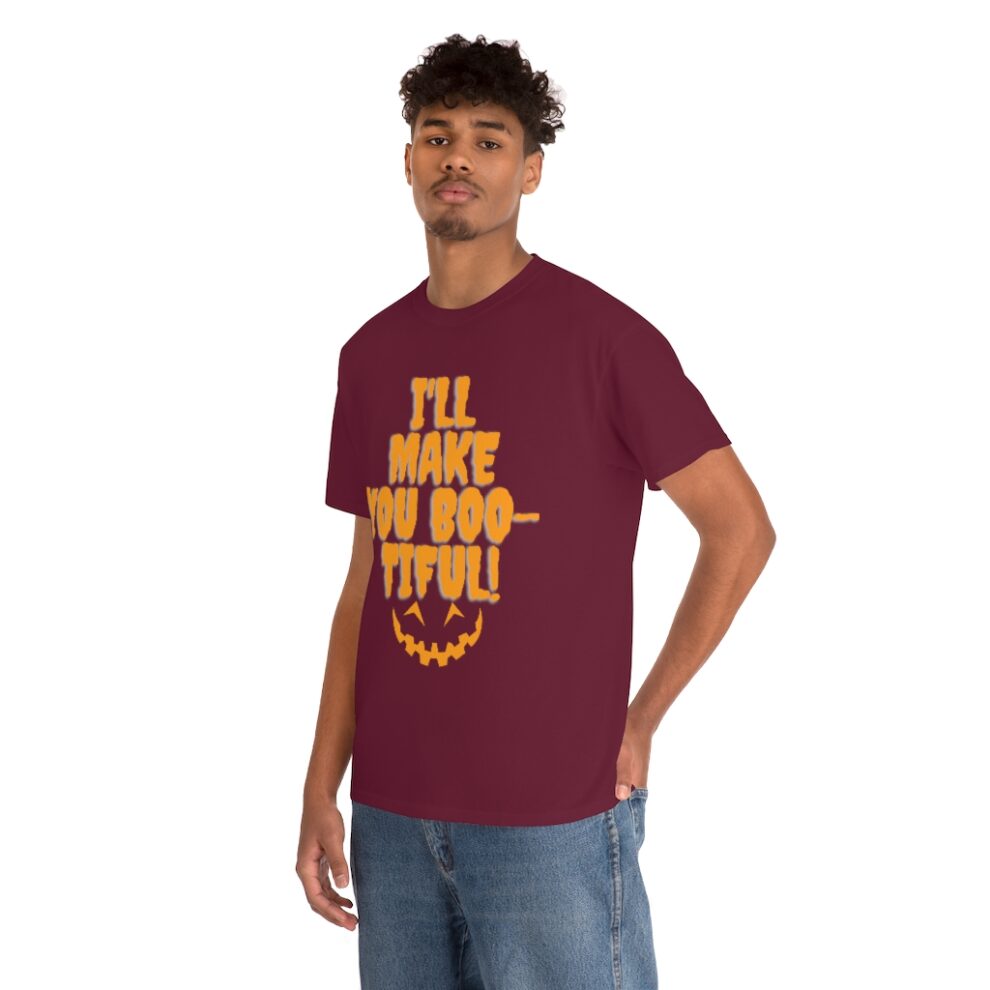 A man wearing a maroon t-shirt with the words " i 'll make you boo-tiful ".