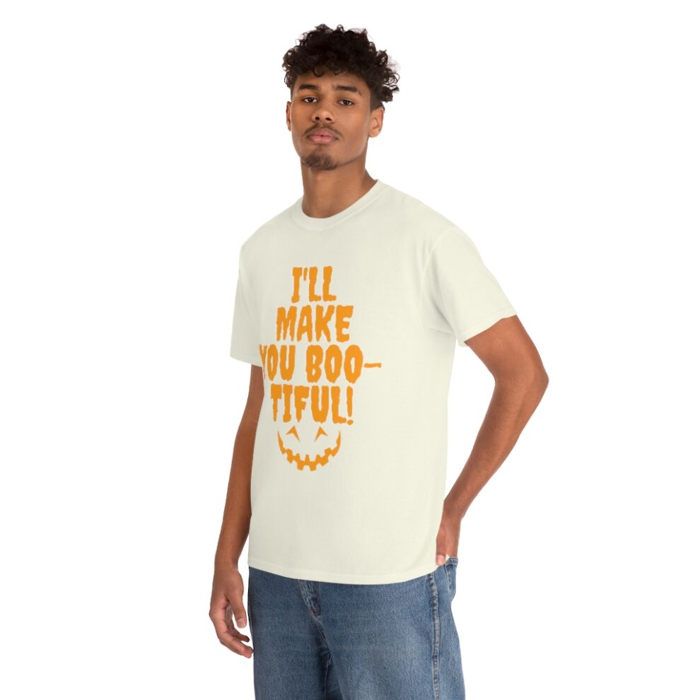 A man wearing a white t-shirt with the words " i 'll make you beautiful ".