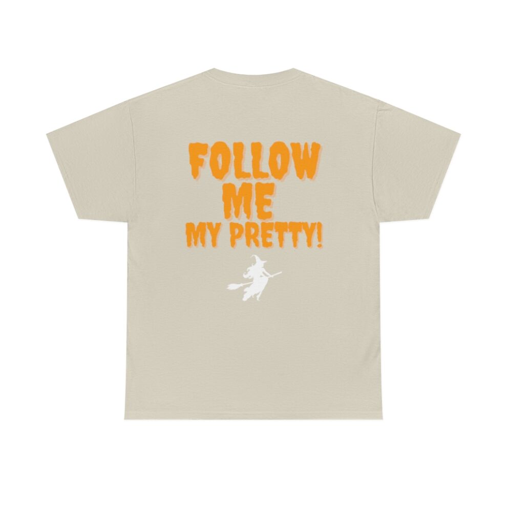 A beige t-shirt with the words " follow me my pretty !" on it.