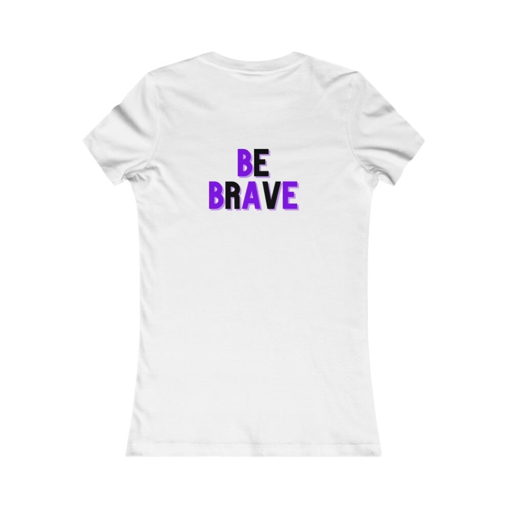 A white t-shirt with the words be brave written in purple.