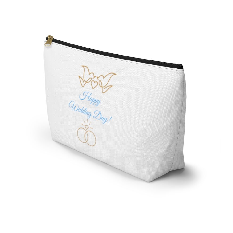 A white bag with a blue and gold design.