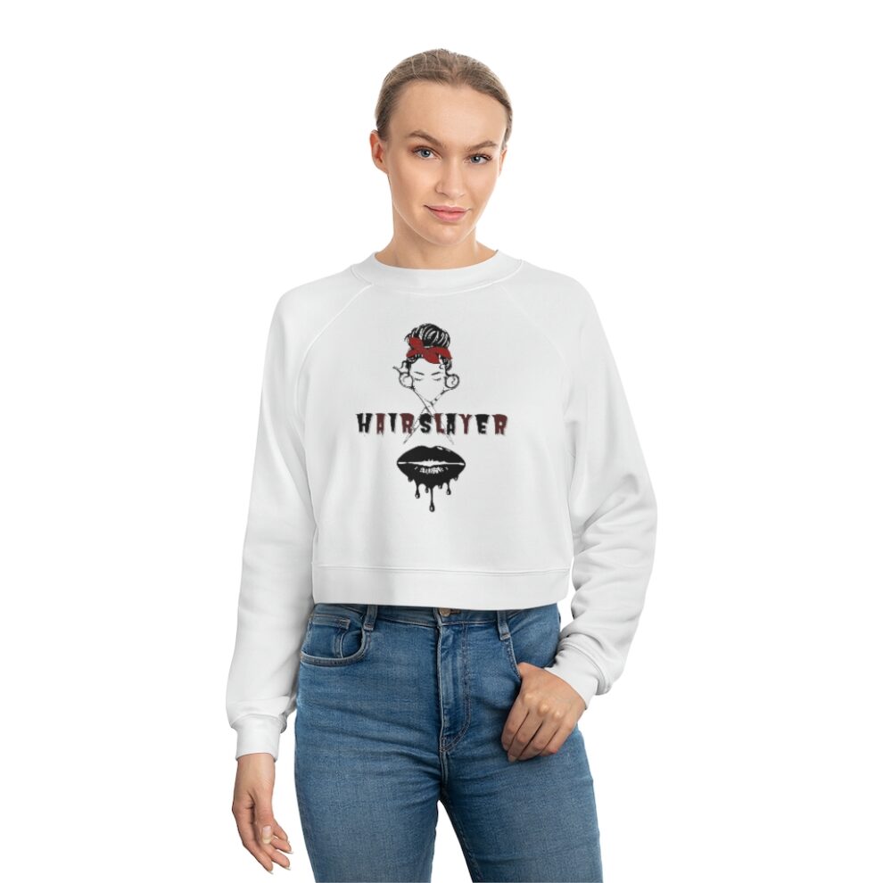 A woman wearing jeans and a white sweatshirt.
