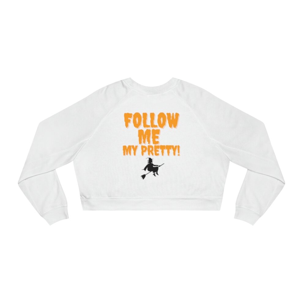 A white sweatshirt with an orange and black text saying follow me my pretty.
