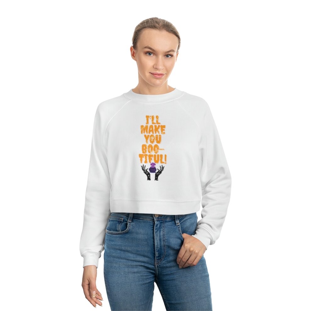 A woman wearing jeans and a white sweatshirt.