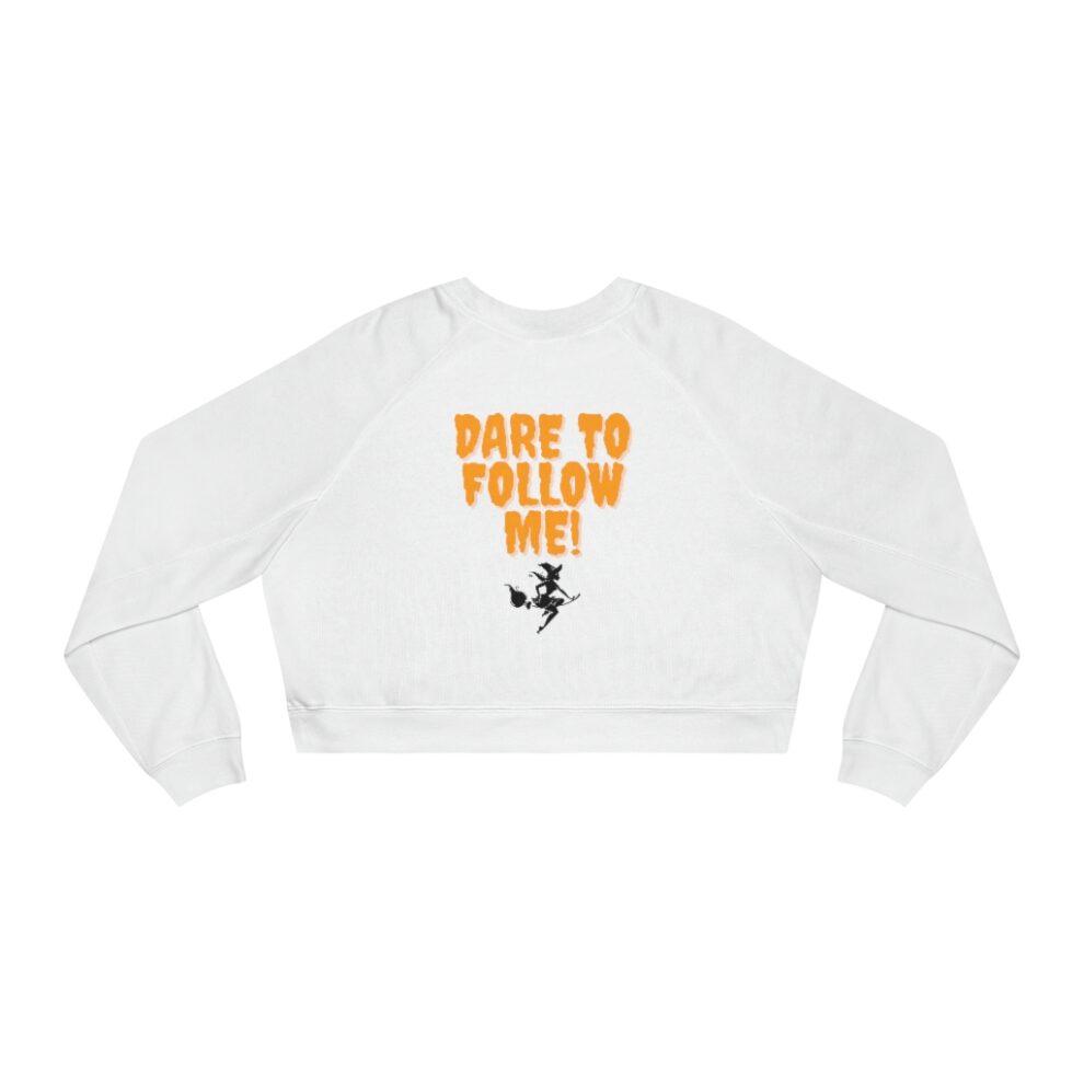 A white sweatshirt with the words " dare to follow me ".