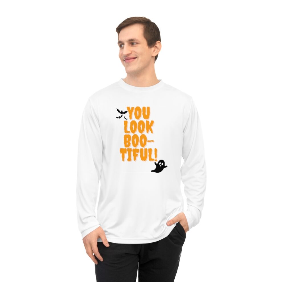 A man wearing a long sleeve t-shirt with the words " you look too tiful ".
