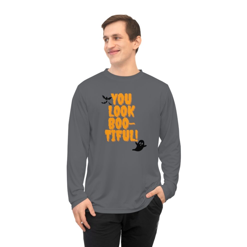 A man wearing an orange and black long sleeve shirt.
