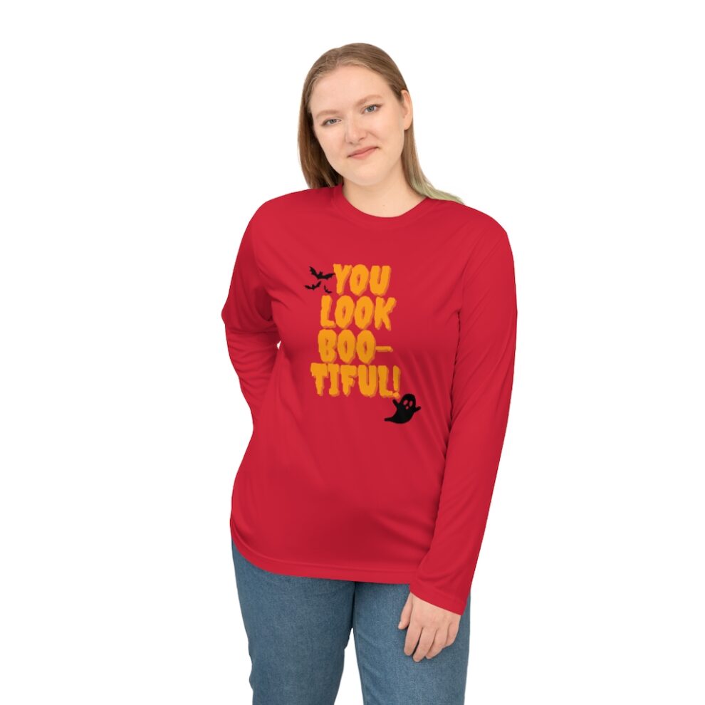 A woman wearing a red long sleeve shirt.