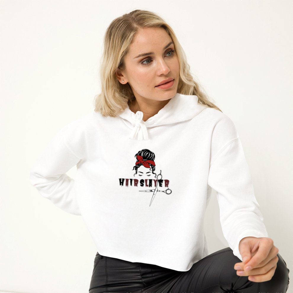 A woman wearing a white hoodie with a red ribbon.
