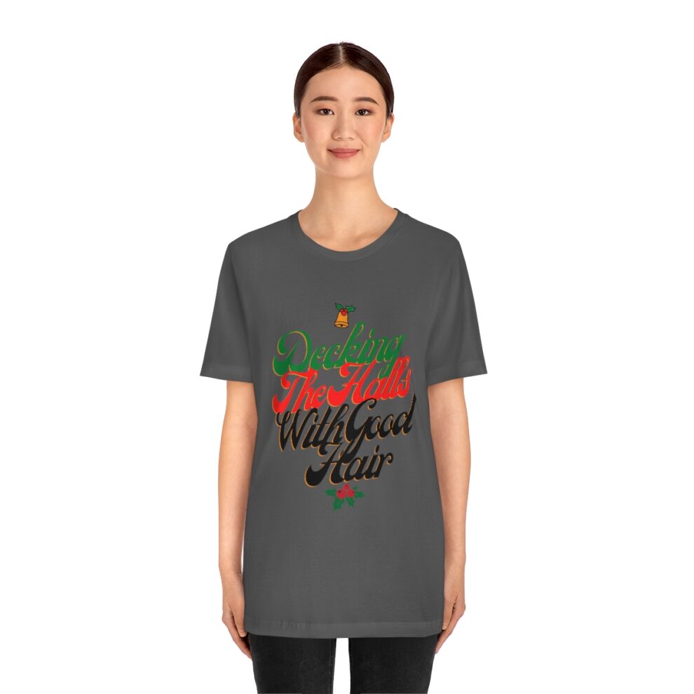 A woman wearing a t-shirt with the words " merry christmas " written on it.