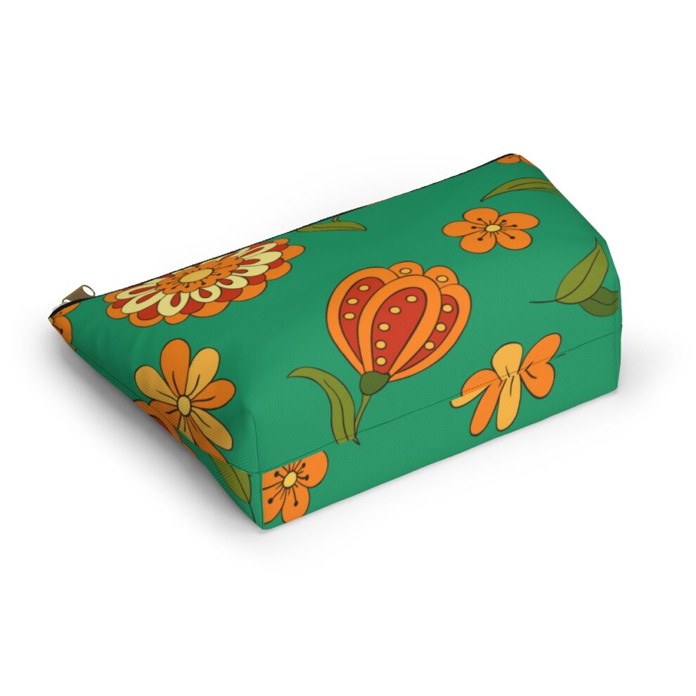 A green box with orange and yellow flowers on it.