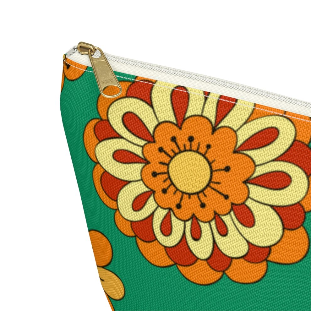 A close up of the side of a green and orange flower pouch