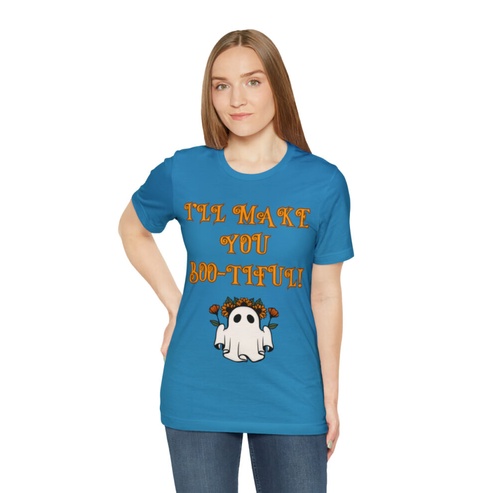 A woman wearing a blue shirt with an image of a ghost.