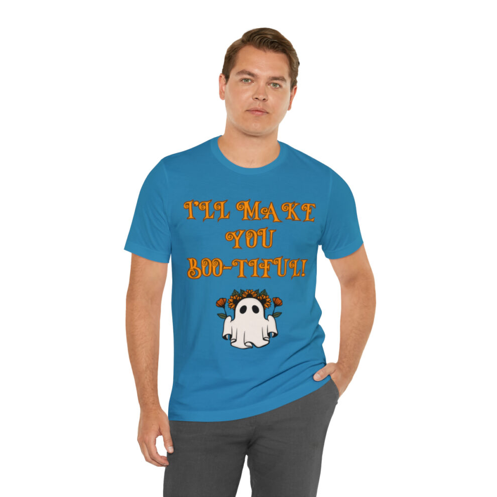 A man wearing a blue shirt with an image of a ghost.