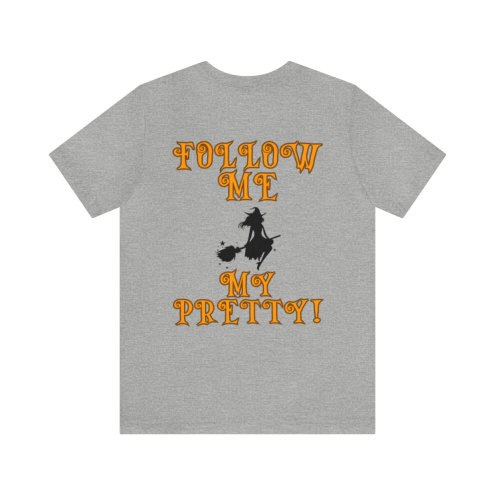 A gray t-shirt with the words " follow me my pretty !" on it.