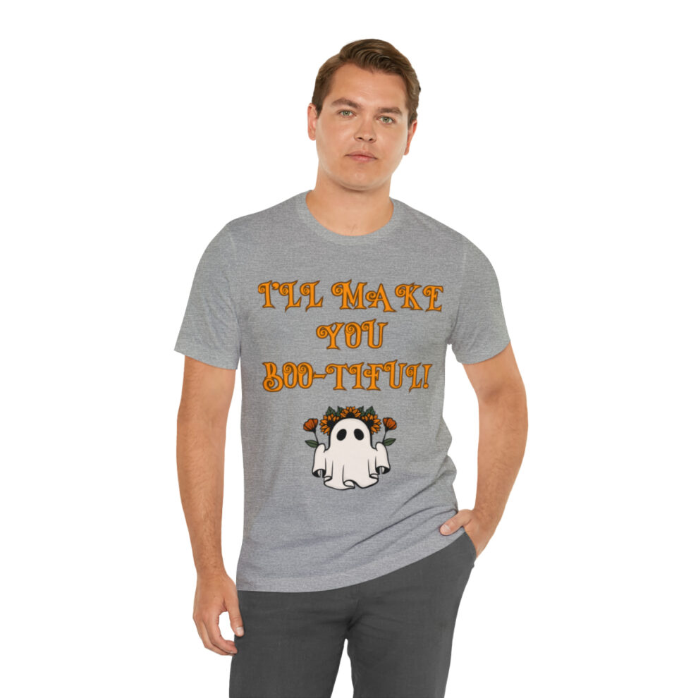 A man wearing a gray t-shirt with an image of a ghost.