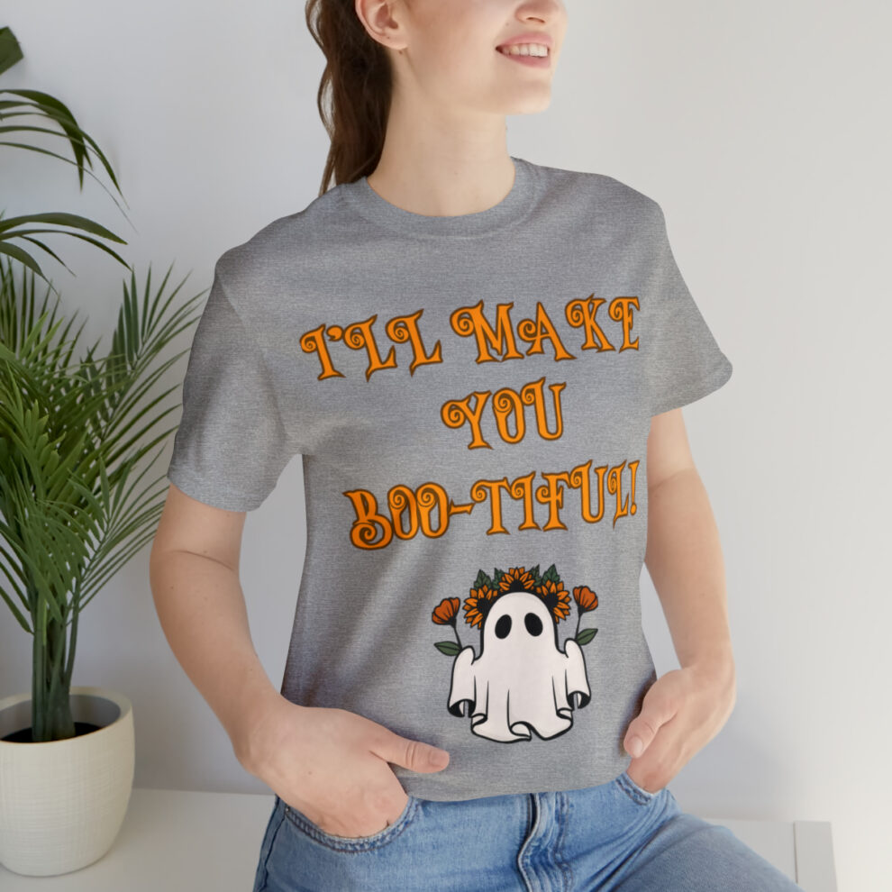 A woman sitting on the ground wearing a t-shirt.