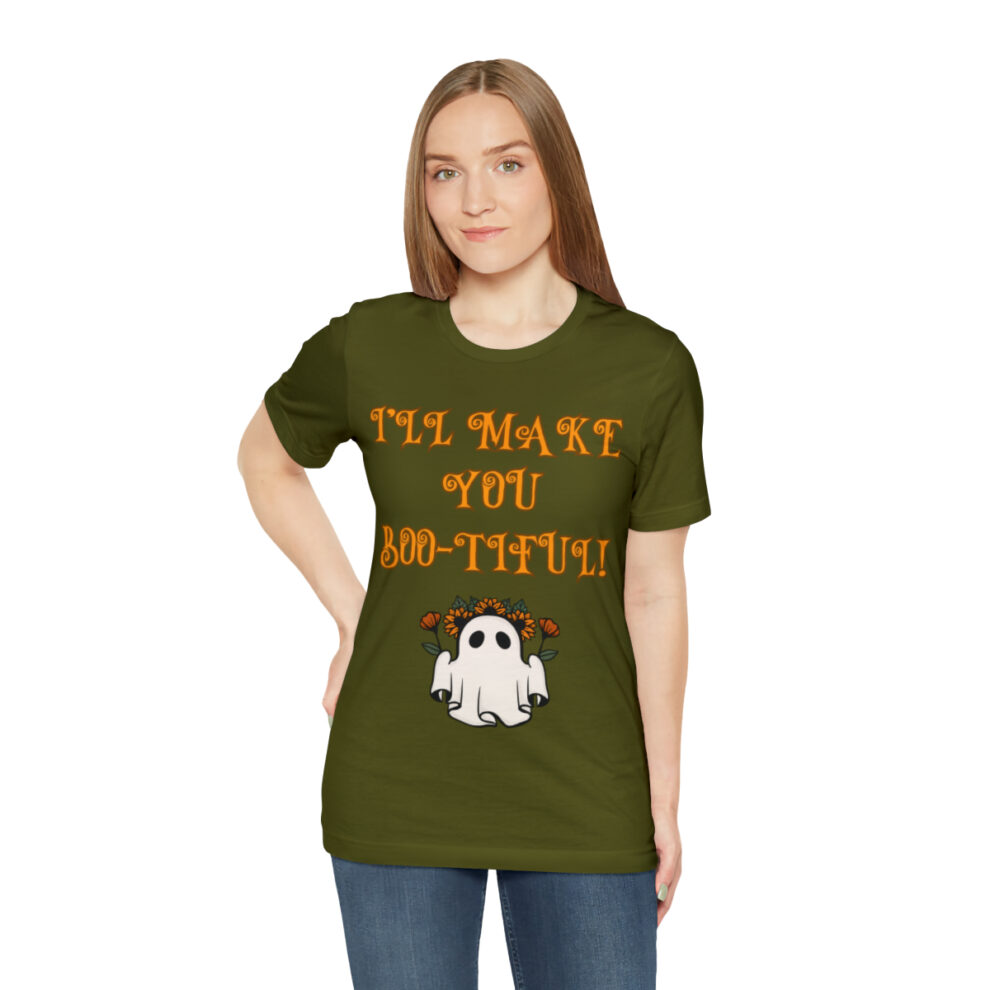 A woman wearing an olive green t-shirt with the words " i 'm nasty you 're thre !" on it.
