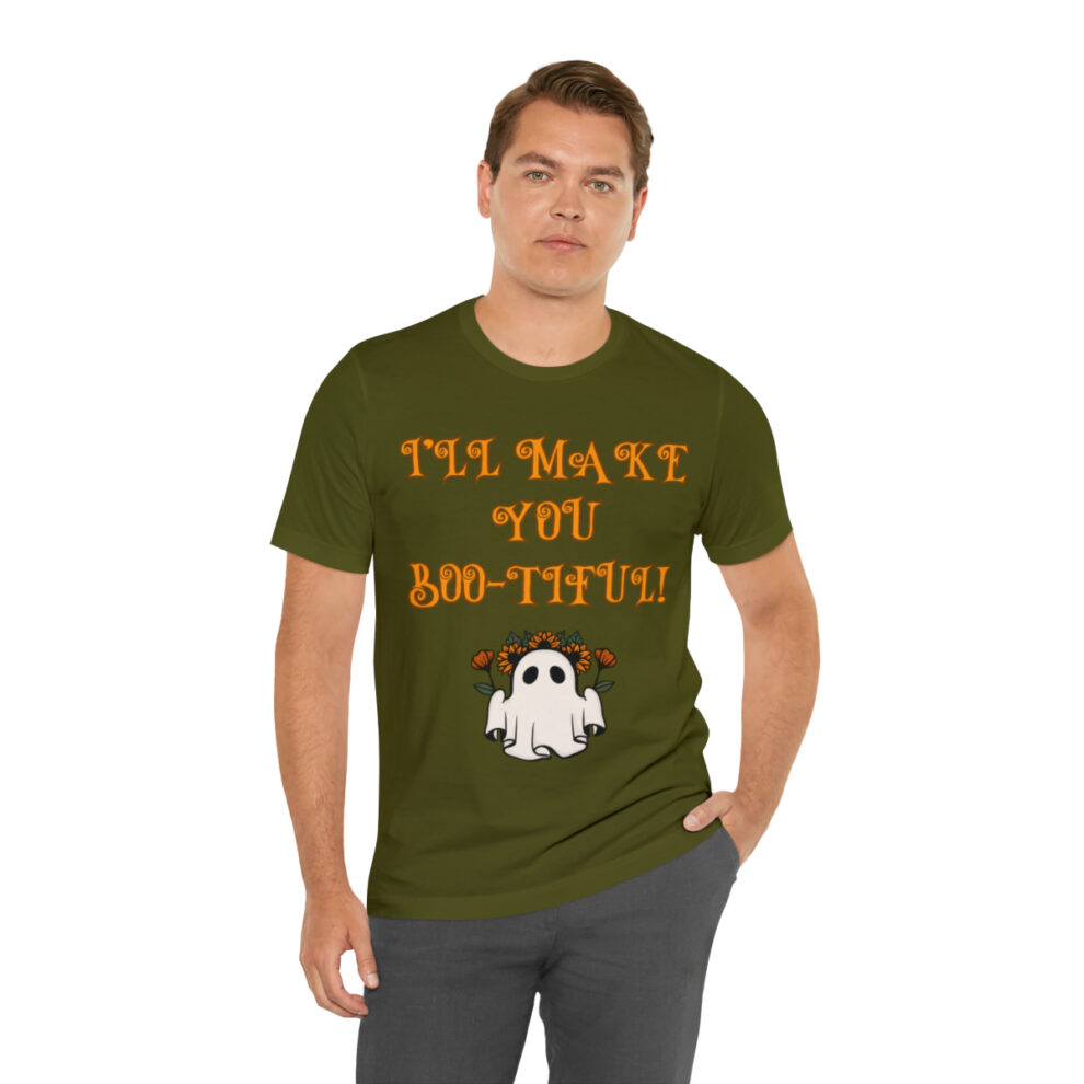 A man wearing an olive green t-shirt with the words " i 'm not you but that !" on it.