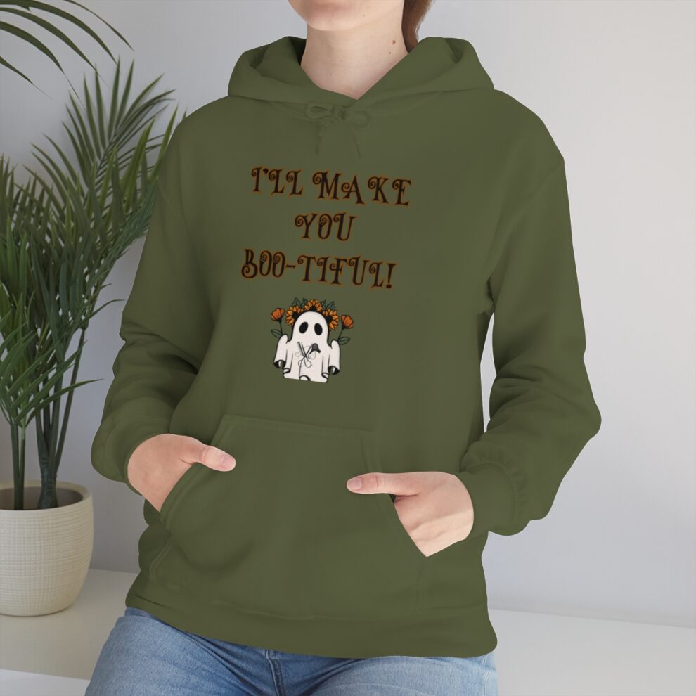 A person wearing a hoodie with an image of a ghost.