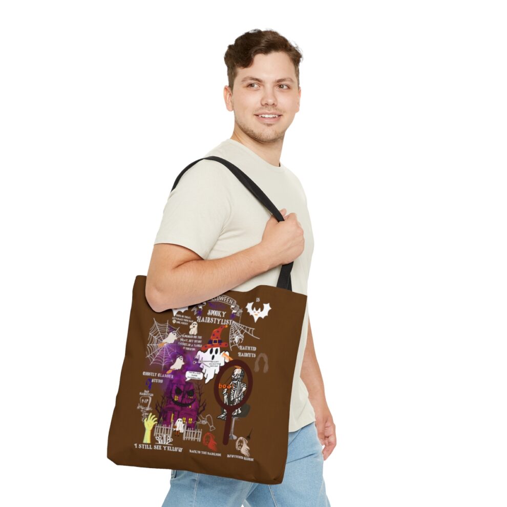 A man holding onto a brown bag with pictures on it