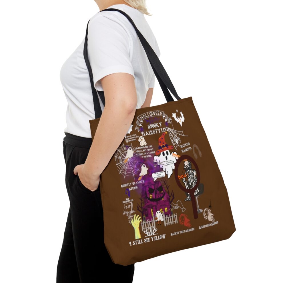 A person holding onto a brown bag with pictures of people.